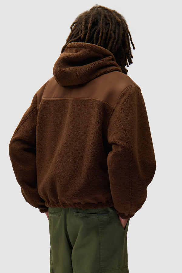 Nylon Technical Jacket in Brown worn by a model, half-body back view