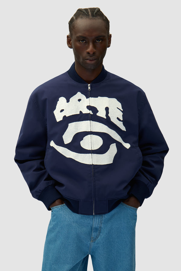Eye Bomber Jacket in Navy worn by a model, half-body front view