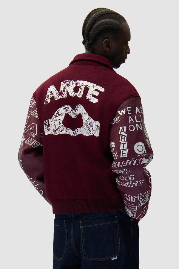 Graffiti Varsity Jacket in Bordeaux worn by a model, half-body back view