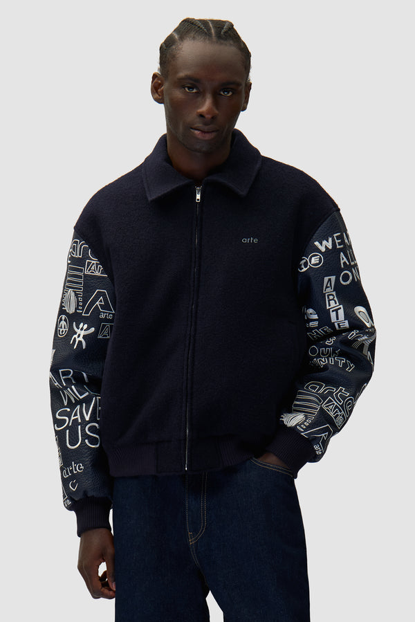 Graffiti Varsity Jacket in Navy worn by a model, half-body front view