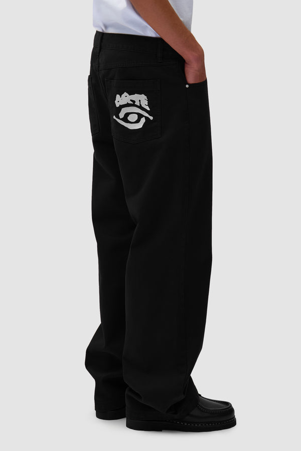 Back Pocket Graphic Pants in Black worn by a model, half-body front view