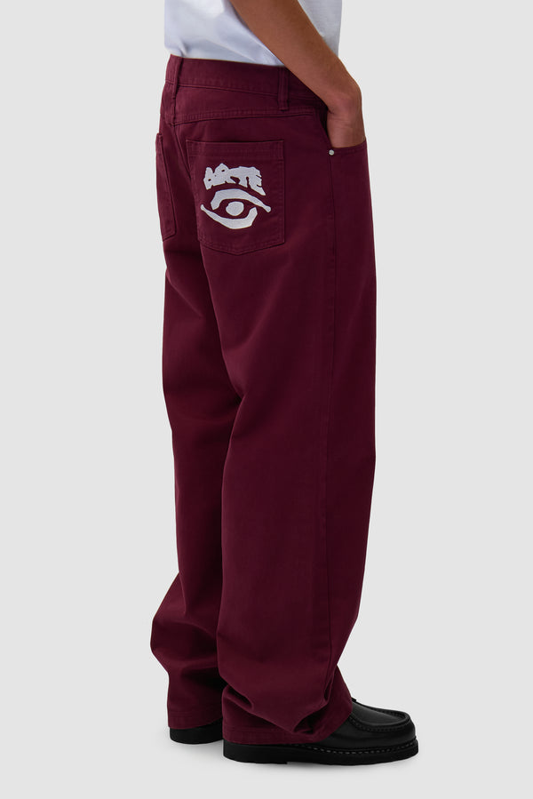 Back Pocket Graphic Pants in Bordeaux worn by a model, half-body front view