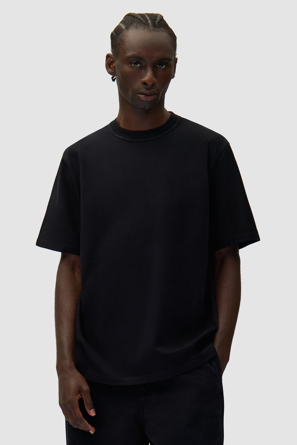 Diels Scribble T-shirt in Black worn by a model, half-body front view