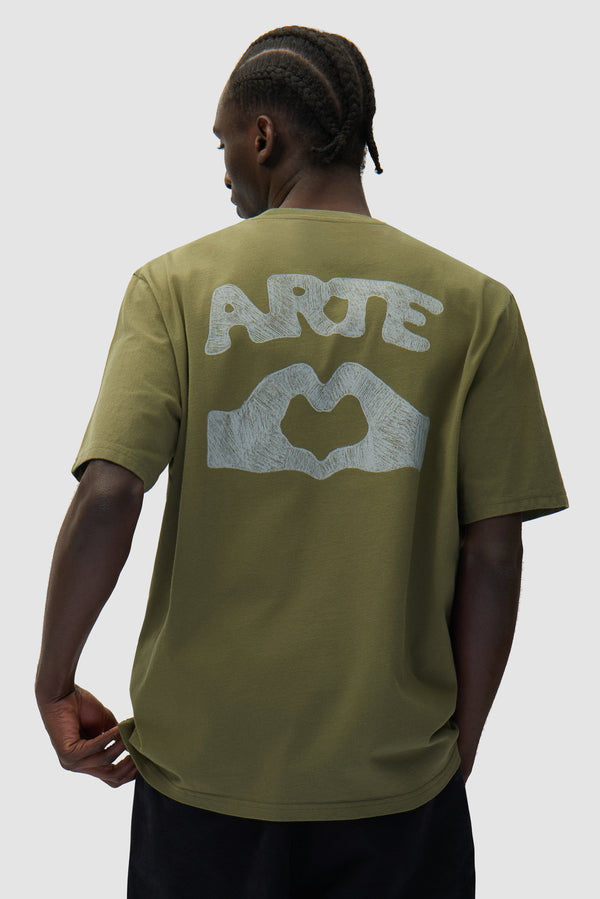 Diels Scribble T-shirt in Green worn by a model, half-body back view
