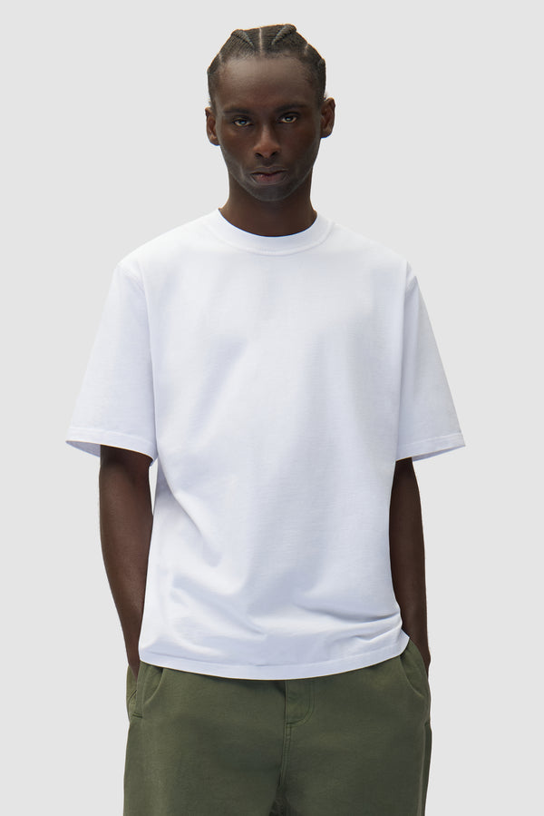 Diels Scribble T-shirt in White worn by a model, half-body front view