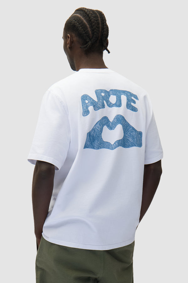 Diels Scribble T-shirt in White worn by a model, half-body back view