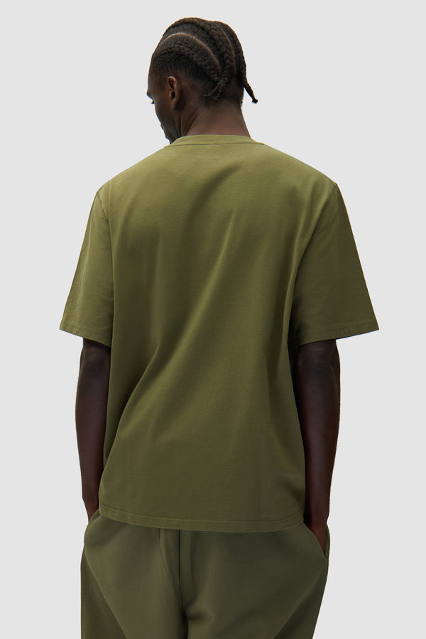 Arte Heart T-shirt in Green worn by a model, half-body back view