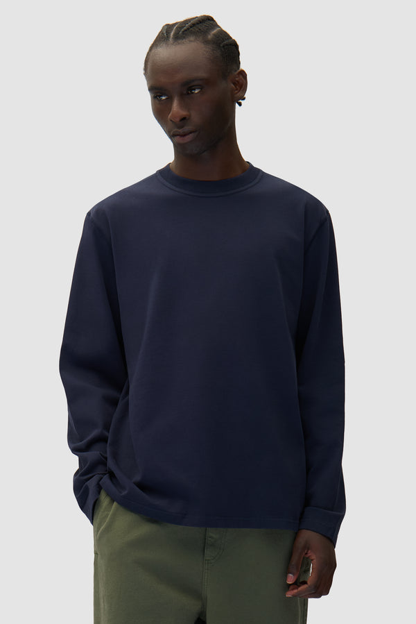 Diels Scribble Longsleeve in Navy worn by a model, half-body front view