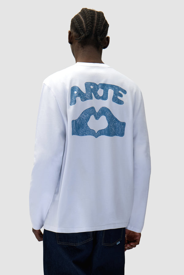 Diels Scribble Longsleeve in White worn by a model, half-body back view