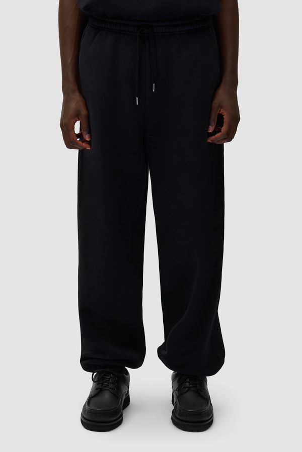 Arte Heart Pants in Black worn by a model, half-body front view