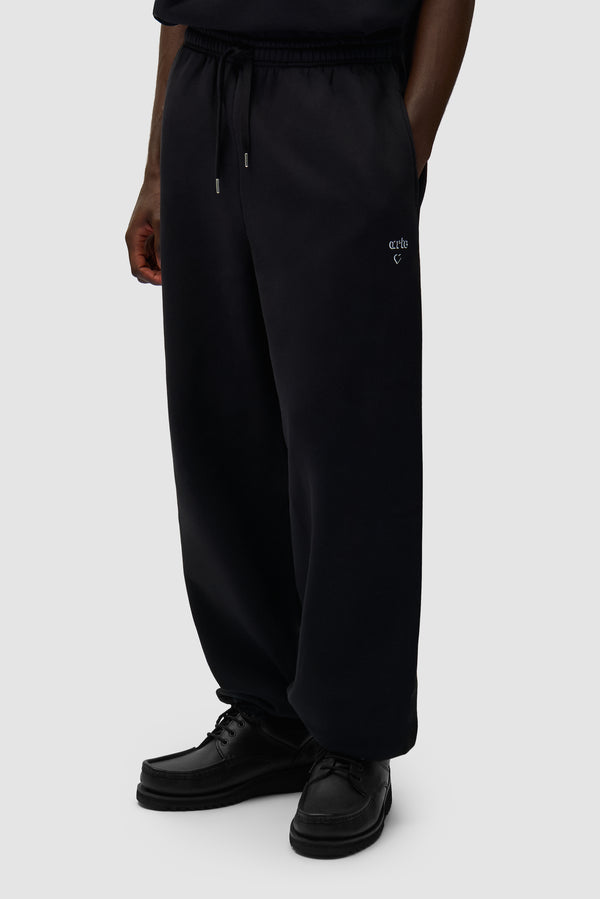 Arte Heart Pants in Black worn by a model, half-body side view