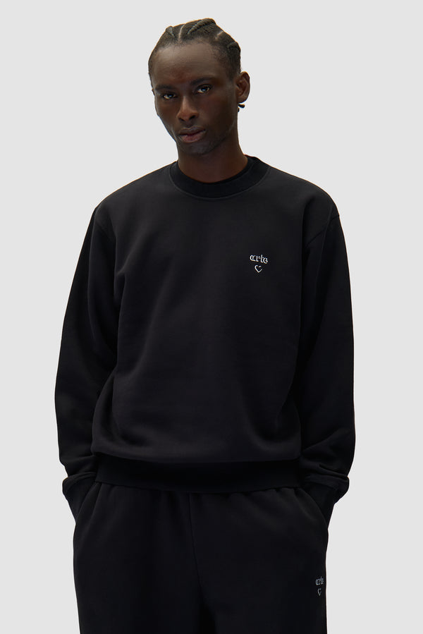 Arte Heart Crewneck in Black worn by a model, half-body front view