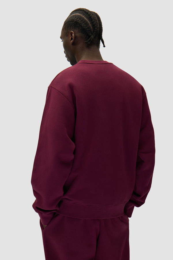 Arte Heart Crewneck in Bordeaux worn by a model, half-body back view