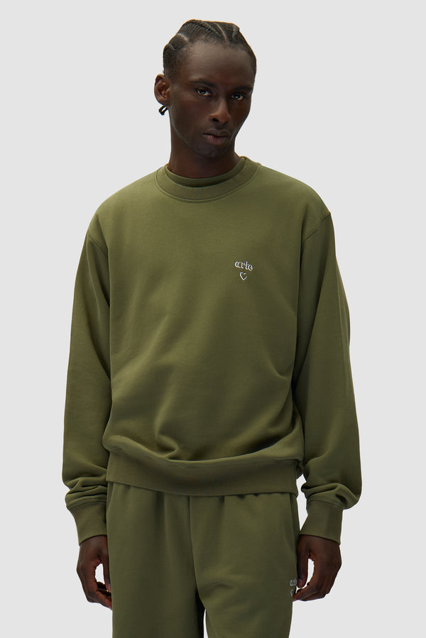 Arte Heart Crewneck in Green worn by a model, half-body front view