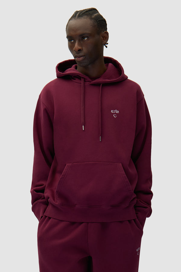 Arte Heart Hoodie in Bordeaux worn by a model, half-body front view