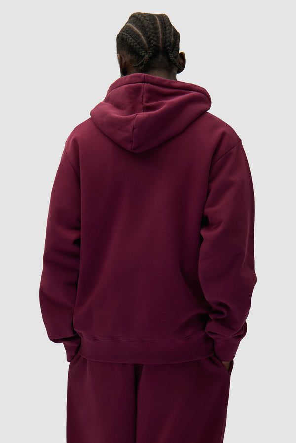 Arte Heart Hoodie in Bordeaux worn by a model, half-body back view