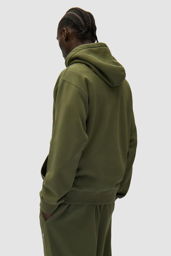 Arte Heart Hoodie in Green worn by a model, half-body back view