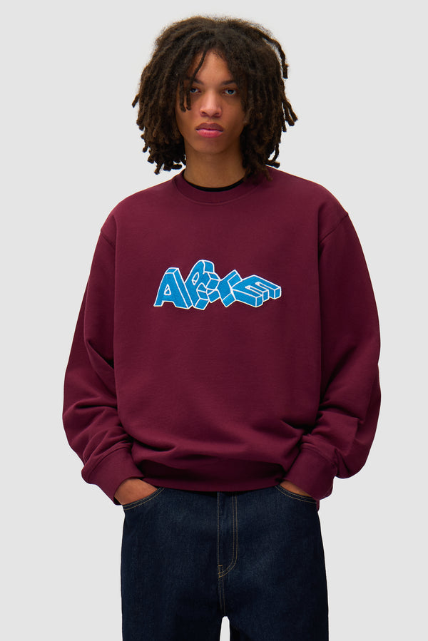 Arte Blocks Crewneck in Bordeaux worn by a model, half-body front view