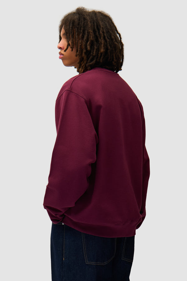 Arte Blocks Crewneck in Bordeaux worn by a model, half-body back view