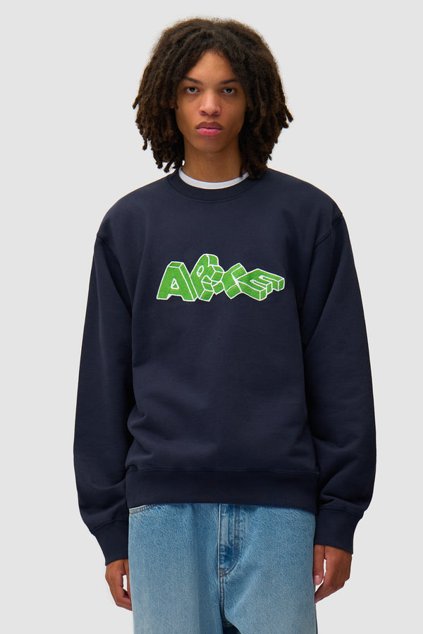 Arte Blocks Crewneck in Navy worn by a model, half-body front view