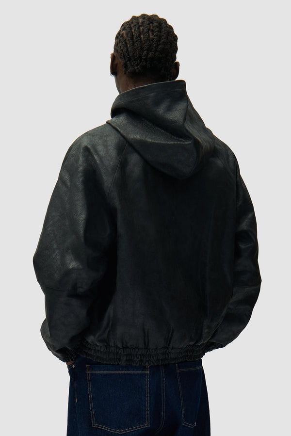 Cracked Leather Jacket in Black worn by a model, half-body back view