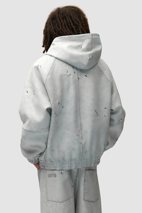 Cracked Leather Jacket in White worn by a model, half-body back view