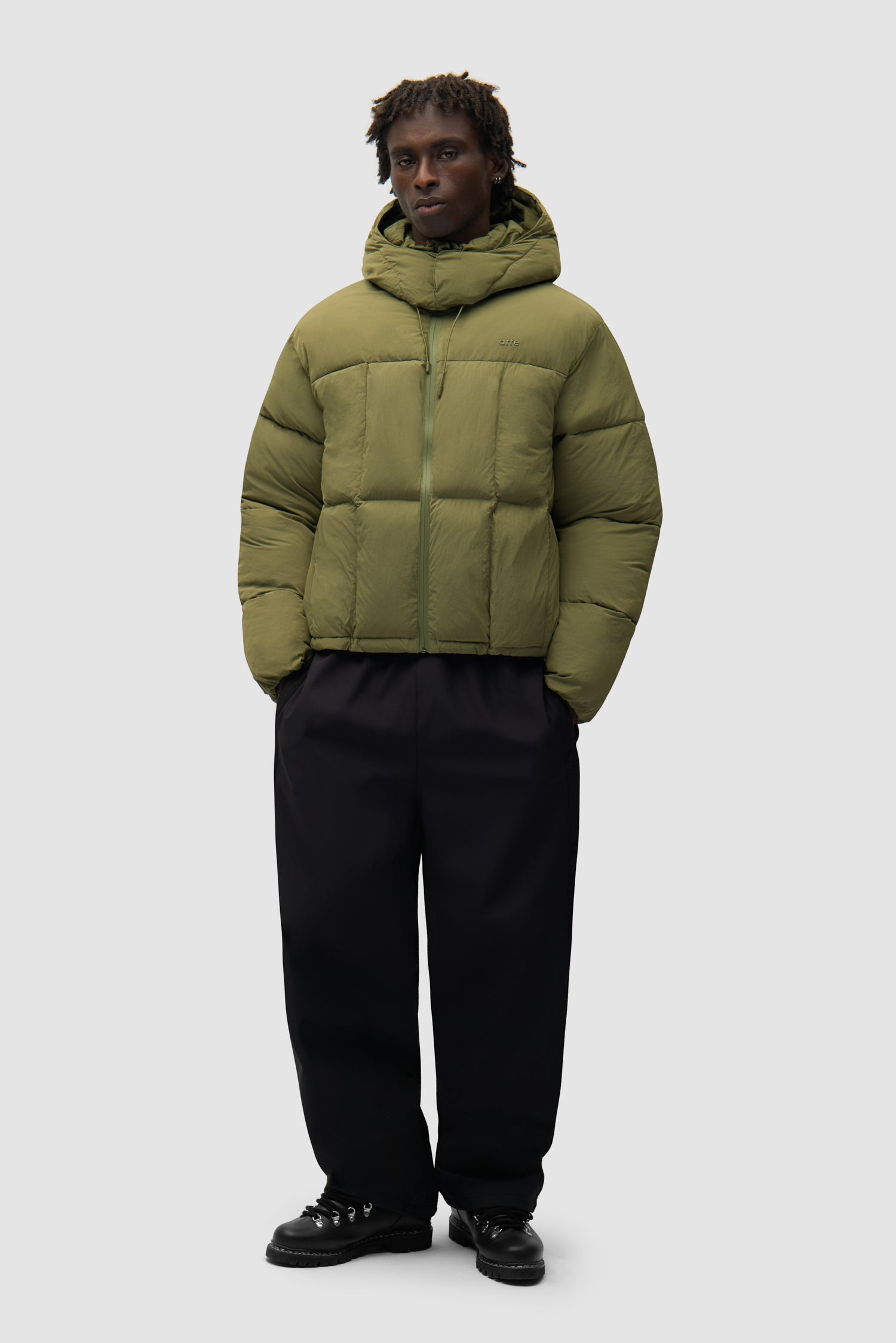 Special Cuts Puffer Jacket in Green worn by a model, full-body front