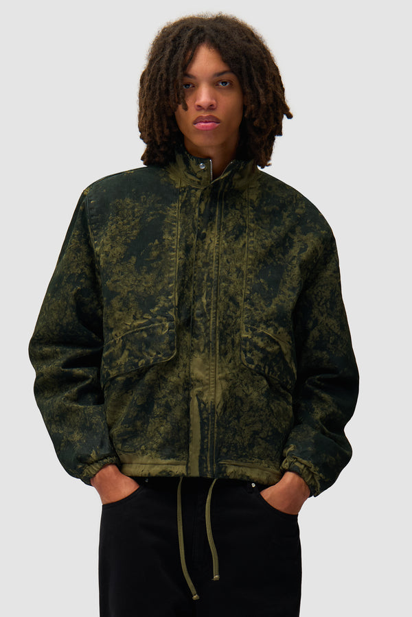 Allover Paint Jacket in Green worn by a model, half-body front view
