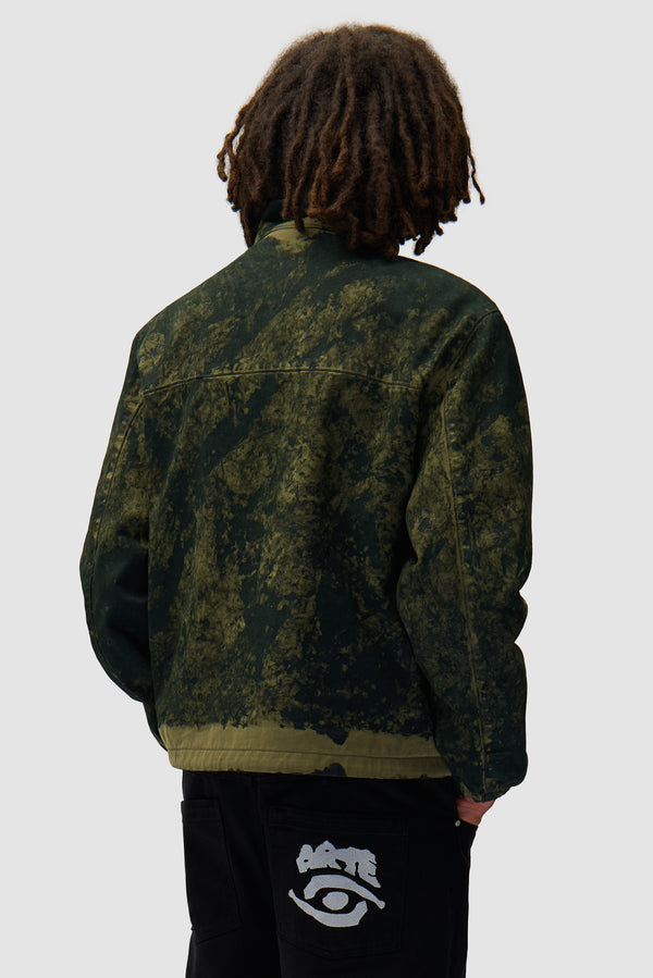 Allover Paint Jacket in Green worn by a model, half-body back view