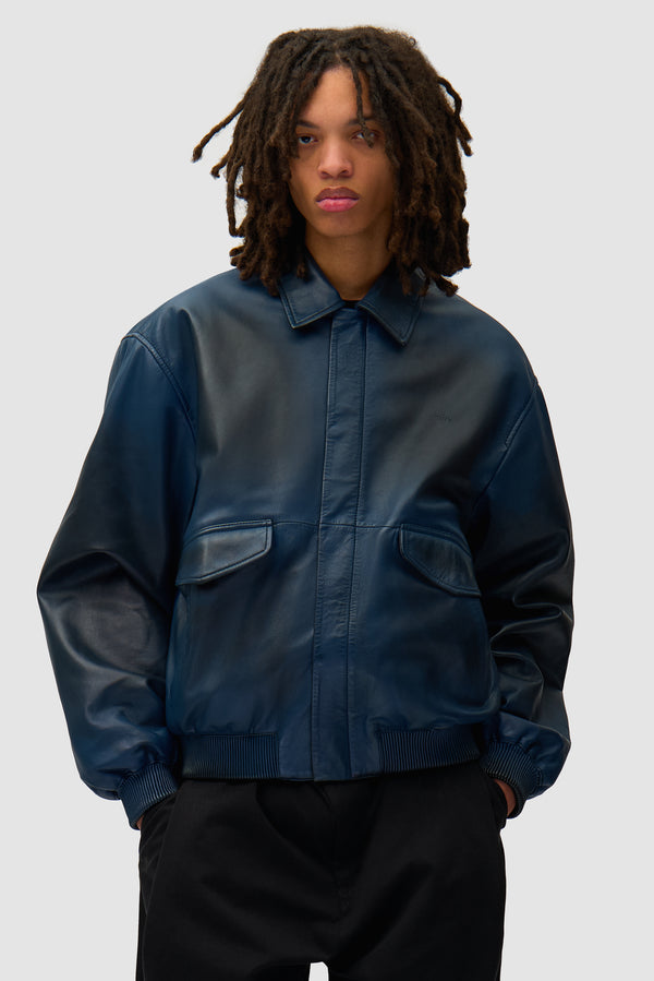 Leather Fade Jacket in Navy worn by a model, half-body front view