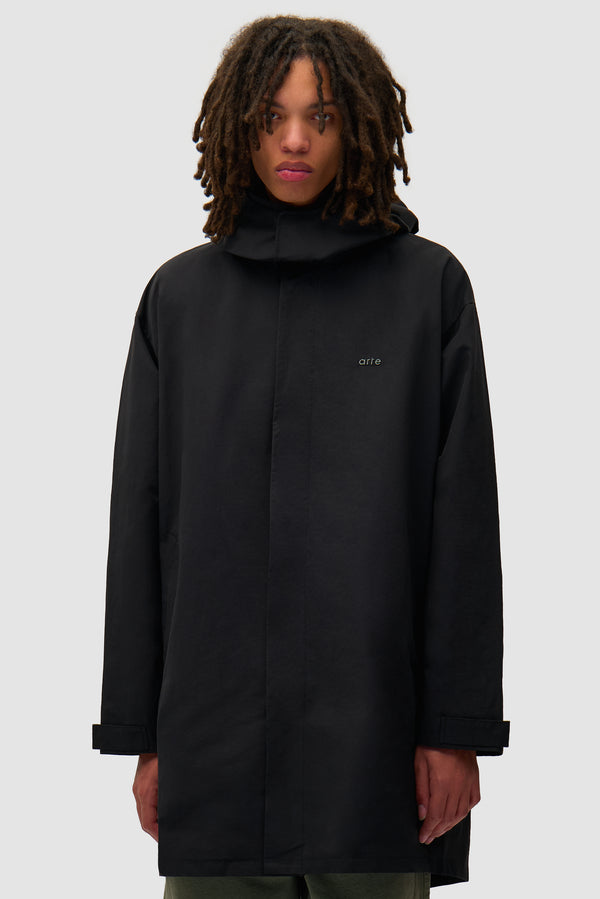 Black Coat in Black worn by a model, half-body front view