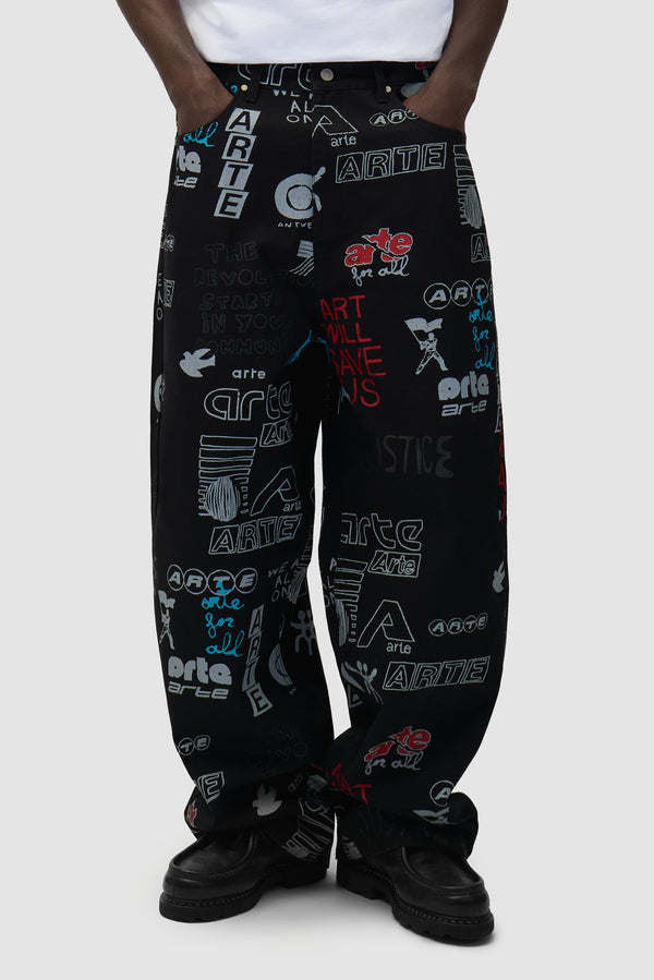 Graffiti Allover Pants in Black worn by a model, half-body front view