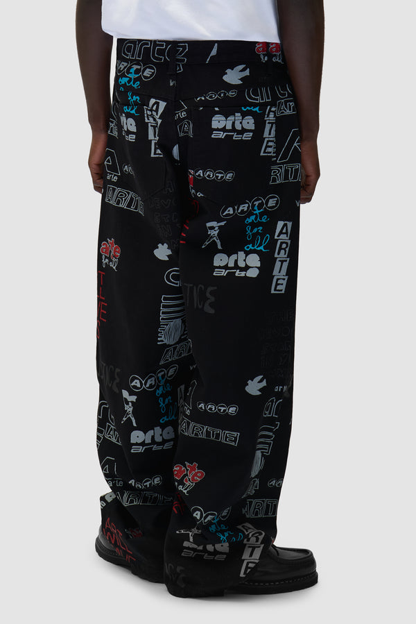 Graffiti Allover Pants in Black worn by a model, half-body back view