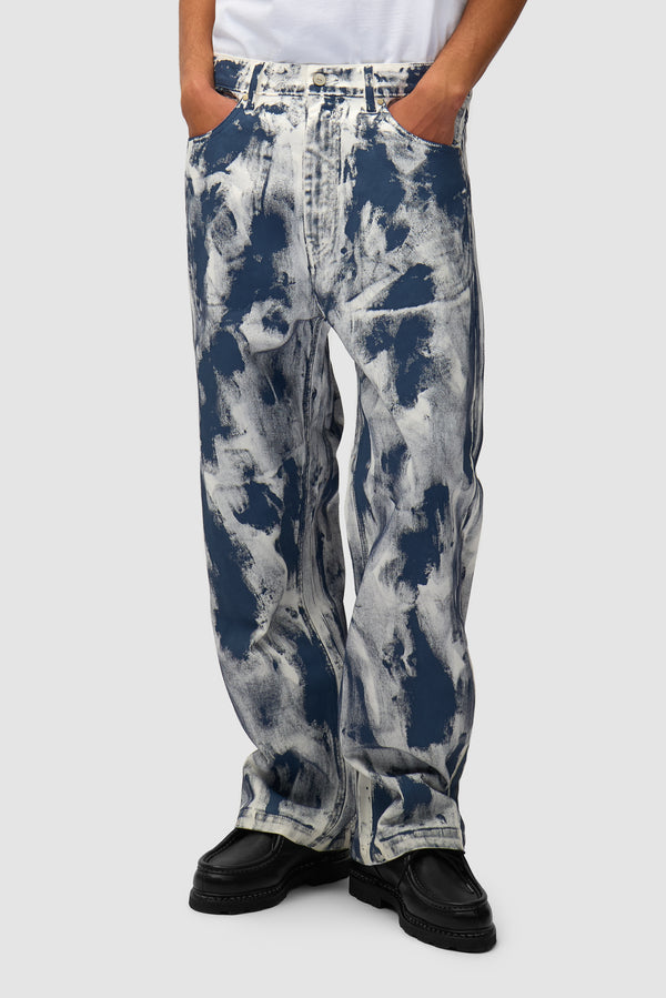 Paint Pants in White worn by a model, half-body front view