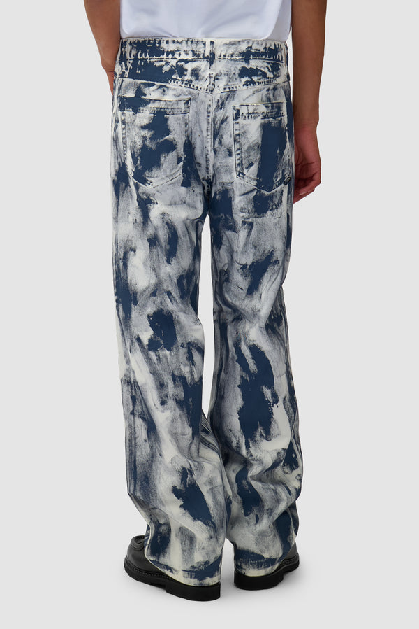 Paint Pants in White worn by a model, half-body back view