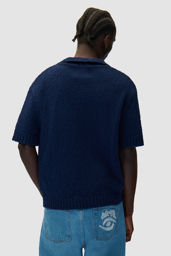 Football Knit in Blue worn by a model, half-body back view