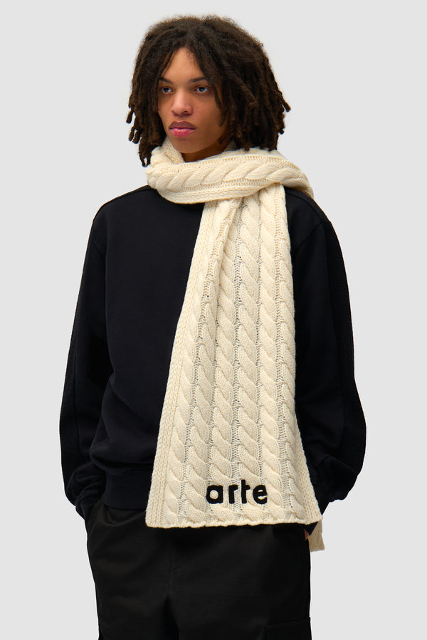 Textured Logo Scarf in Cream worn by a model, half-body front view