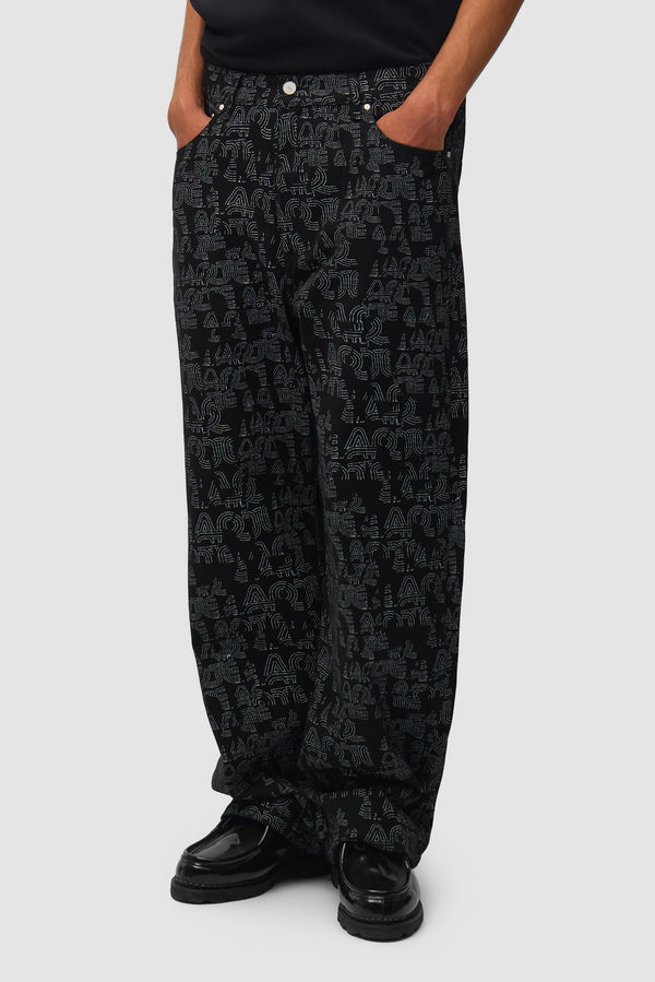 Allover Arte Pants in Black worn by a model, half-body back view