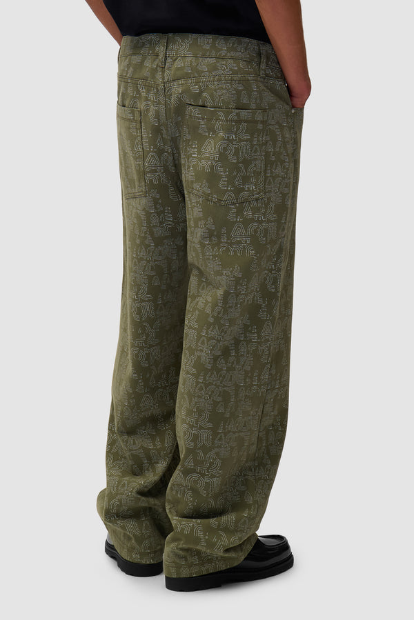 Allover Arte Pants in Green worn by a model, half-body back view