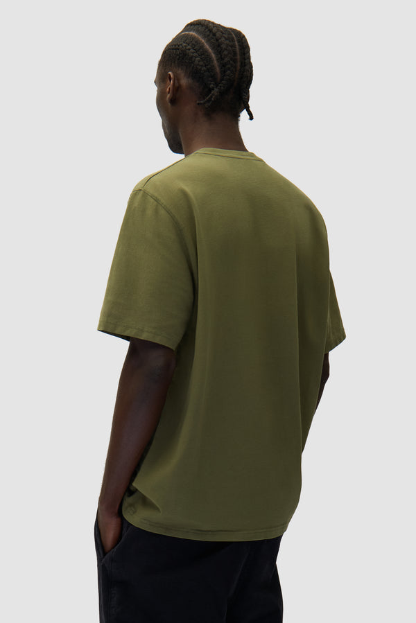 Arte Pixel T-shirt in Green worn by a model, half-body back view