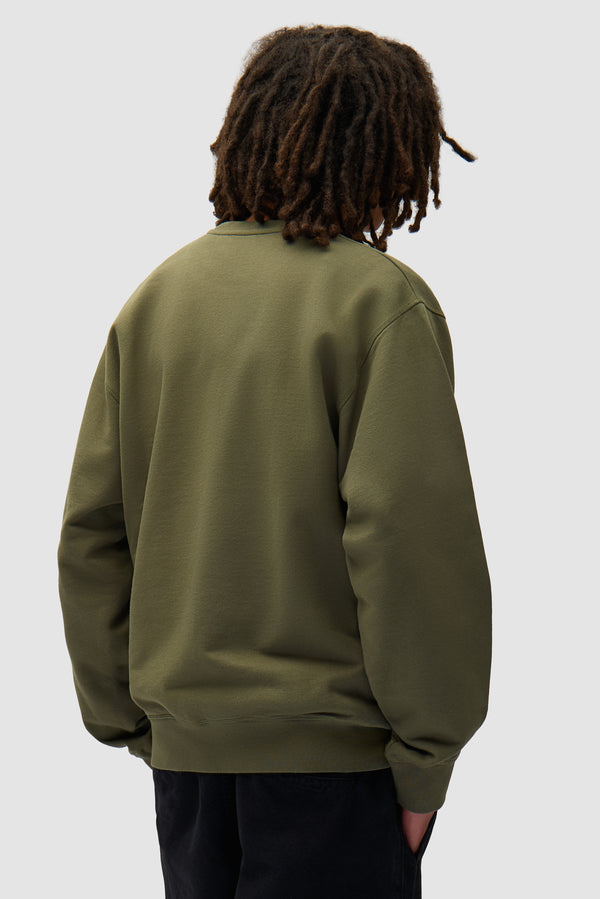 Arte Pixel Crewneck in Green worn by a model, half-body back view