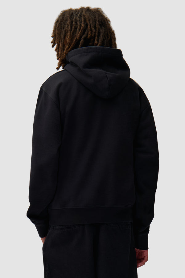 Arte Pixel Hoodie in Black worn by a model, half-body back view