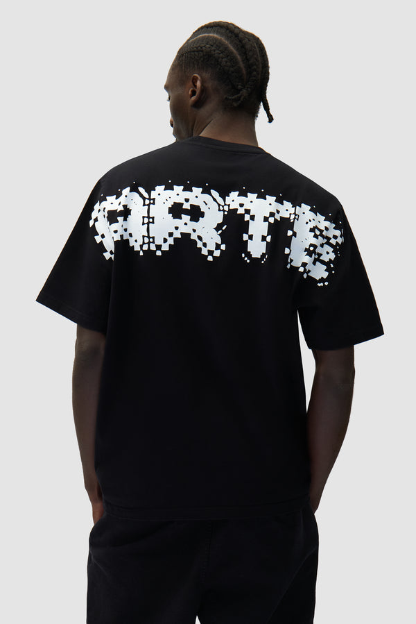 Pixel Back T-shirt in Black worn by a model, half-body back view
