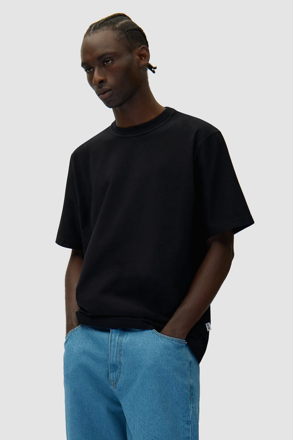 Eye Print T-shirt in Black worn by a model, half-body front view
