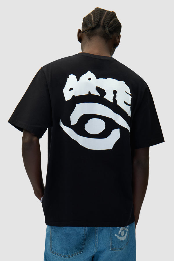 Eye Print T-shirt in Black worn by a model, half-body back view