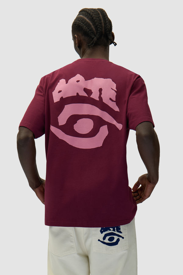 Eye Print T-shirt in Bordeaux worn by a model, half-body back view
