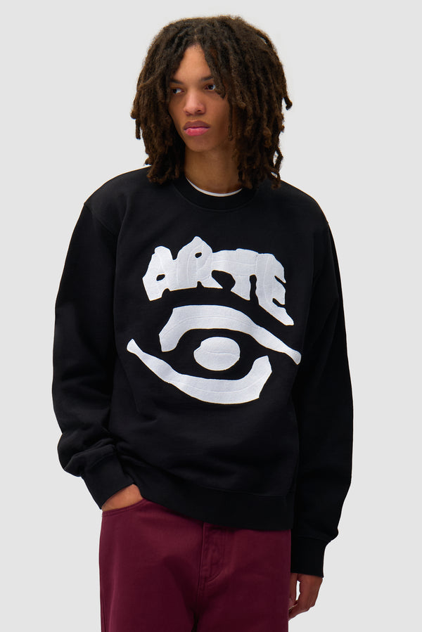 Eye Front Crewneck in Black worn by a model, half-body front view