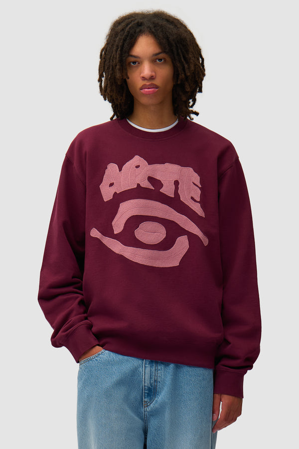 Eye Front Crewneck in Bordeaux worn by a model, half-body front view