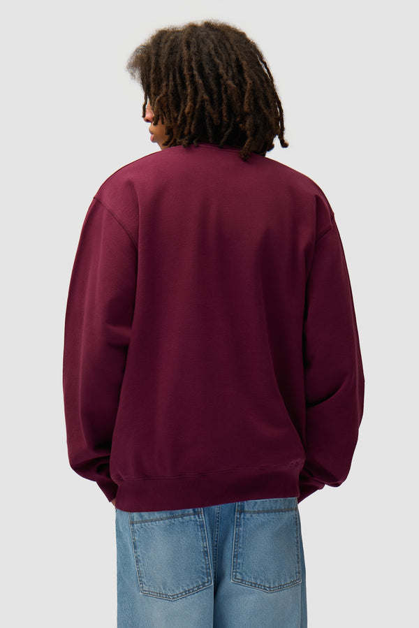 Eye Front Crewneck in Bordeaux worn by a model, half-body back view