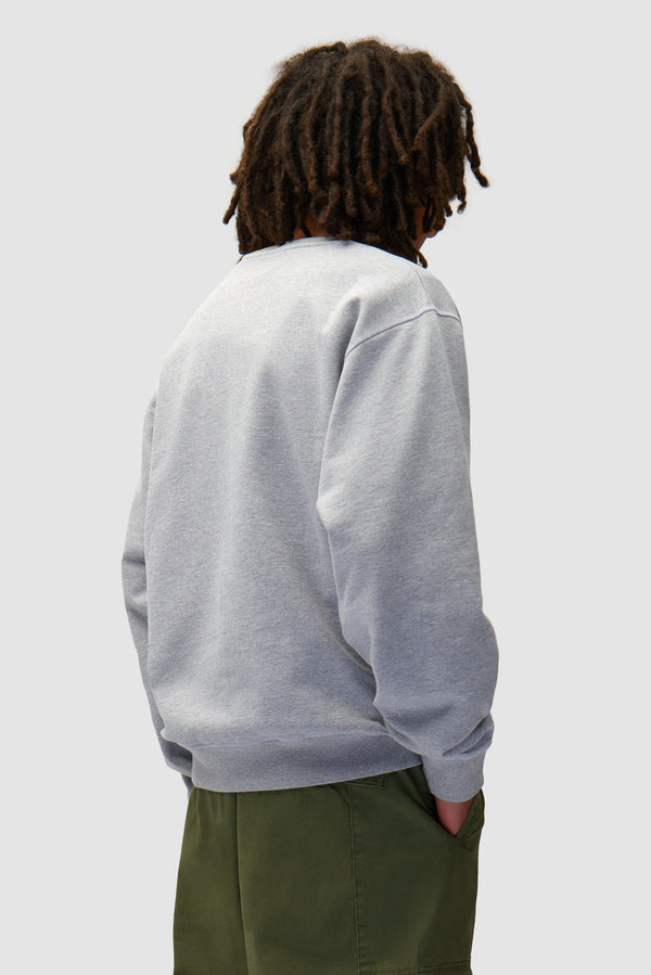 Eye Front Crewneck in Grey worn by a model, half-body back view